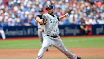 Jul 24, 2016; Toronto, Ontario, CAN; Seattle Mariners starting pitcher Wade Miley (20) delivers a pitch in the second inning against theToronto Blue Jays at Rogers Centre. Mandatory Credit: Kevin Sousa-USA TODAY Sports