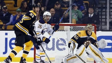 Nov 7, 2016; Boston, MA, USA; Buffalo Sabres left wing Matt Moulson (26) is defended by Boston Bruins defenseman Zdeno Chara (33) with goalie Tuukka Rask (40) in goal during the third period at TD Garden. The Boston Bruins won 4-0. Mandatory Credit: Greg M. Cooper-USA TODAY Sports