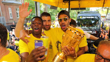 DORTMUND, GERMANY - MAY 28: (L-R) Ousmane Dembele, Sokratis Papastathopoulos and Pierre-Emerick Aubameyang of Borussia Dortmund lift the DFB Cup trophy as the team celebrates during a winner's parade at Borsigplatz on May 28, 2017 in Dortmund, Germany. (Photo by Pool - Getty Images)