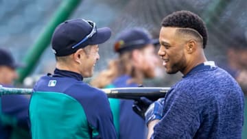 SEATTLE, WA - MAY 3: Ichiro Suzuki #51 (L) of the Seattle Mariners and Robinson Cano #22 of the Seattle Mariners talk during batting practice before a game before a game against the Oakland Athletics at Safeco Field on May 3, 2018 in Seattle, Washington. The Mariners won the game 4-1. (Photo by Stephen Brashear/Getty Images) *** Local Caption *** Ichiro Suzuki;Robinson Cano