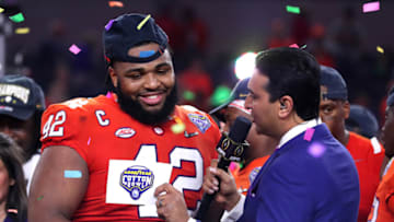 ARLINGTON, TEXAS - DECEMBER 29: Christian Wilkins #42 of the Clemson Tigers speaks to ESPN's Kevin Neghandi after defeating the Notre Dame Fighting Irish during the College Football Playoff Semifinal Goodyear Cotton Bowl Classic at AT&T Stadium on December 29, 2018 in Arlington, Texas. Clemson defeated Notre Dame 30-3. (Photo by Tom Pennington/Getty Images)