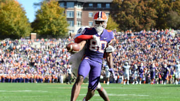 Nov 13, 2021; Clemson, South Carolina, USA; Clemson Tigers wide receiver Beaux Collins (80) makes a touchdown catch against Connecticut Huskies defensive back Stan Cross (17) during the second quarter at Memorial Stadium. Mandatory Credit: Adam Hagy-USA TODAY Sports