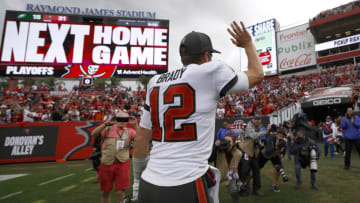 TAMPA, FLORIDA - JANUARY 16: Tom Brady #12 of the Tampa Bay Buccaneers celebrates after defeating the Philadelphia Eagles in the NFC Wild Card Playoff game at Raymond James Stadium on January 16, 2022 in Tampa, Florida. (Photo by Douglas P. DeFelice/Getty Images)