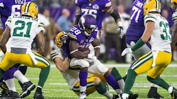 Sep 18, 2016; Minneapolis, MN, USA; Minnesota Vikings running back Adrian Peterson (28) carries the ball and is injured on the play during the third quarter against the Green Bay Packers at U.S. Bank Stadium. The Vikings defeated the Packers 17-14. Mandatory Credit: Brace Hemmelgarn-USA TODAY Sports