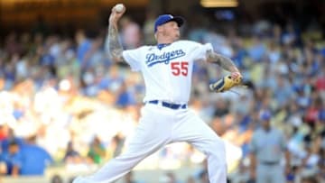 August 29, 2015; Los Angeles, CA, USA; Los Angeles Dodgers starting pitcher Mat Latos (55) pitches the first inning against the Chicago Cubs at Dodger Stadium. Mandatory Credit: Gary A. Vasquez-USA TODAY Sports