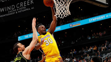 ATLANTA, GA - FEBRUARY 26: Julius Randle #30 of the Los Angeles Lakers attacks the basket against Miles Plumlee #18 and Andrew White III #4 of the Atlanta Hawks at Philips Arena on February 26, 2018 in Atlanta, Georgia. NOTE TO USER: User expressly acknowledges and agrees that, by downloading and or using this photograph, User is consenting to the terms and conditions of the Getty Images License Agreement. (Photo by Kevin C. Cox/Getty Images)