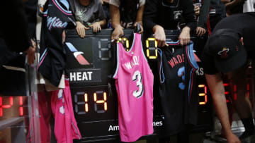 Fans wave Dwyane Wade jerseys after the game against the Atlanta Hawks (Photo by Michael Reaves/Getty Images)