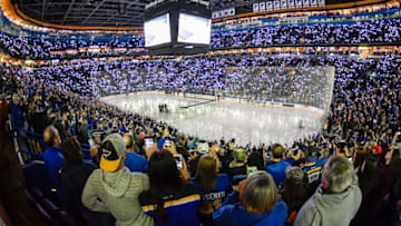 ST. LOUIS, MO - DECEMBER 1: Fans hold up their camera flash lights for Hockey Fights Cancer Night prior to a game between the St. Louis Blues and the Los Angeles Kings at Scottrade Center on December 1, 2017 in St. Louis, Missouri. (Photo by Jeff Curry/NHLI via Getty Images)