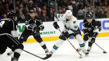 December 22, 2015; Los Angeles, CA, USA; San Jose Sharks center Tomas Hertl (48) moves the puck against the defense of Los Angeles Kings center Jeff Carter (77), left wing Tanner Pearson (70) and defenseman Drew Doughty (8) during the first period at Staples Center. Mandatory Credit: Gary A. Vasquez-USA TODAY Sports