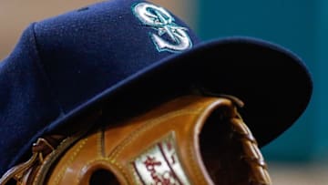 Apr 27, 2015; Arlington, TX, USA; A view of a Seattle Mariners hat and baseball glove during the game between the Texas Rangers and the Mariners at Globe Life Park in Arlington. The Mariners defeated the Rangers 3-1. Mandatory Credit: Jerome Miron-USA TODAY Sports