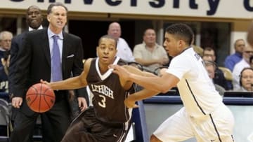 November 13, 2012; Pittsburgh, PA, USA; Lehigh Mountain Hawks guard C.J. McCollum (3) handles the ball against pressure by Pittsburgh Panthers guard James Robinson (right) during the first half at the Petersen Events Center. Mandatory Credit: Charles LeClaire-USA TODAY Sports