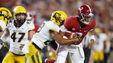 TUSCALOOSA, AL - OCTOBER 13: Jalen Hurts #2 of the Alabama Crimson Tide gets tackled after catching a pass against Khalil Oliver #20 of the Missouri Tigers in the first quarter of the game at Bryant-Denny Stadium on October 13, 2018 in Tuscaloosa, Alabama. (Photo by Joe Robbins/Getty Images)