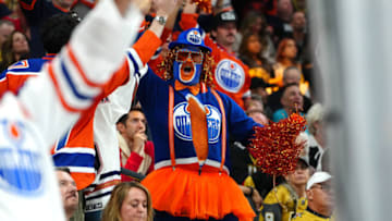 May 12, 2023; Las Vegas, Nevada, USA; Edmonton Oilers fans celebrate after Edmonton Oilers center Connor McDavid (97) scored a goal against the Vegas Golden Knights during the first period of game five of the second round of the 2023 Stanley Cup Playoffs at T-Mobile Arena. Mandatory Credit: Stephen R. Sylvanie-USA TODAY Sports