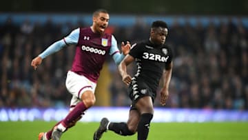 BIRMINGHAM, ENGLAND - APRIL 13: Lewis Grabban of Aston Villa challenges of Ronaldo Vieira of Leeds United during the Sky Bet Championship match between Aston Villa and Leeds United at Villa Park on April 13, 2018 in Birmingham, England. (Photo by Michael Regan/Getty Images)