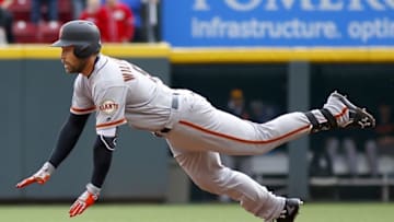 May 4, 2016; Cincinnati, OH, USA; San Francisco Giants pinch hitter Mac Williamson dives into second base for a double against the Cincinnati Reds during the ninth inning at Great American Ball Park. The Reds won 7-4. Mandatory Credit: David Kohl-USA TODAY Sports