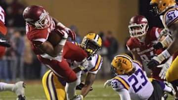 Nov 15, 2014; Fayetteville, AR, USA; Arkansas Razorbacks running back Jonathan Williams (32) is tackled by LSU Tigers safety Ronald Martin (26) during the first half at Donald W. Reynolds Razorback Stadium. Mandatory Credit: Jasen Vinlove-USA TODAY Sports