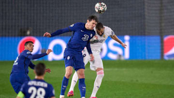 MADRID, SPAIN - APRIL 27: Karim Benzema of Real Madrid competes for the ball with Andreas Christensen of Chelsea FC during the UEFA Champions League Semi Final First Leg match between Real Madrid and Chelsea FC at Estadio Alfredo Di Stefano on April 27, 2021 in Madrid, Spain. Sporting stadiums around Spain remain under strict restrictions due to the Coronavirus Pandemic as Government social distancing laws prohibit fans inside venues resulting in games being played behind closed doors. (Photo by Diego Souto/Quality Sport Images/Getty Images)