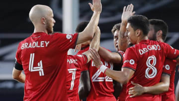 Richie Laryea of Toronto FC celebrates with teammates. (Photo by Michael Reaves/Getty Images)