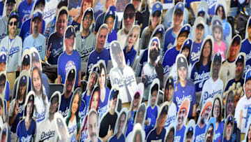 LOS ANGELES, CALIFORNIA - JULY 23: Cardboard cutouts of Los Angeles Dodgers fans are seen in seats before the Opening Day game between the San Francisco Giants and the Los Angeles Dodgers at Dodger Stadium on July 23, 2020 in Los Angeles, California. The 2020 season had been postponed since March due to the COVID-19 pandemic. (Photo by Harry How/Getty Images)