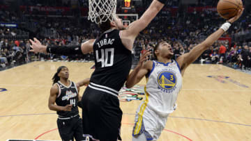 LOS ANGELES, CA - FEBRUARY 14: Jordan Poole #3 of the Golden State Warriors goes up for a layup against Ivica Zubac #40 of the Los Angeles Clippers during the first half at Crypto.com Arena on February 14, 2023 in Los Angeles, California. NOTE TO USER: User expressly acknowledges and agrees that, by downloading and or using this photograph, User is consenting to the terms and conditions of the Getty Images License Agreement. (Photo by Kevork Djansezian/Getty Images)