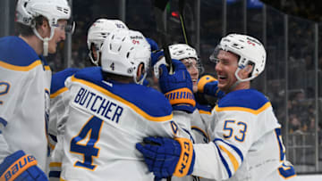 Jan 1, 2022; Boston, Massachusetts, USA; Buffalo Sabres left wing Jeff Skinner (53) celebrates with center Peyton Krebs (19) and defenseman Will Butcher (4) a goal scored by right wing Alex Tuch (89) against the Boston Bruins during the second period at TD Garden. Mandatory Credit: Brian Fluharty-USA TODAY Sports
