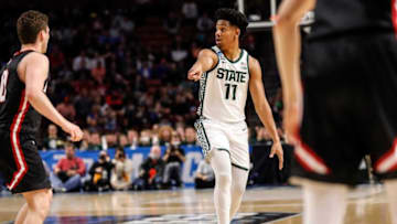 Michigan State guard A.J. Hoggard signals teammates against Davidson during the first half of the first round of NCAA tournament on Friday, March 18, 2022, in Greenville, South Carolina.