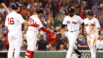 BOSTON, MA - JUNE 28: Jackie Bradley Jr. #19 high fives Mookie Betts #50 of the Boston Red Sox after hitting a two-run home run in the seventh inning a game against the Los Angeles Angels at Fenway Park on June 28, 2018 in Boston, Massachusetts. (Photo by Adam Glanzman/Getty Images)