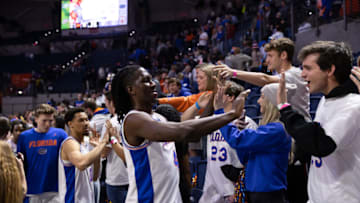 Jan 29, 2022; Gainesville, Florida, USA; Florida Gators forward Anthony Duruji (4) high fives the student section during the second half against the Oklahoma State Cowboys at Billy Donovan Court at Exactech Arena. Mandatory Credit: Matt Pendleton-USA TODAY Sports