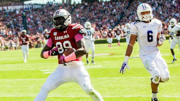 Oct 18, 2014; Columbia, SC, USA; South Carolina Gamecocks tight end Jerell Adams (89) scores on a reception past Furman Paladins safety Thomas Brown (6) in the second quarter at Williams-Brice Stadium. Mandatory Credit: Jeff Blake-USA TODAY Sports