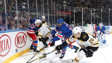 NEW YORK, NY - OCTOBER 27: Marc Staal #18 of the New York Rangers battles for the puck against Par Lindholm #26 of the Boston Bruins at Madison Square Garden on October 27, 2019 in New York City. (Photo by Jared Silber/NHLI via Getty Images)