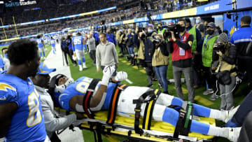 INGLEWOOD, CALIFORNIA - DECEMBER 16: Donald Parham #89 of the Los Angeles Chargers is taken off the field to be assessed further for injury in the first quarter of the game against the Kansas City Chiefs at SoFi Stadium on December 16, 2021 in Inglewood, California. (Photo by Kevork Djansezian/Getty Images)