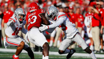 Ohio State Buckeyes defensive back Cameron Martinez (10) and Ohio State Buckeyes cornerback Denzel Burke (29) move in to tackle Rutgers Scarlet Knights running back Kyle Monangai (23) during the second quarter of a NCAA Division I football game between the Rutgers Scarlet Knights and the Ohio State Buckeyes on Saturday, Oct. 2, 2021 at SHI Stadium in Piscataway, New Jersey.Cfb Ohio State Buckeyes At Rutgers Scarlet Knights