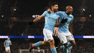 MANCHESTER, ENGLAND - JANUARY 20: Sergio Aguero of Manchester City celebrates scoring his side's third goal with Fernandinho during the Premier League match between Manchester City and Newcastle United at Etihad Stadium on January 20, 2018 in Manchester, England. (Photo by Shaun Botterill/Getty Images)