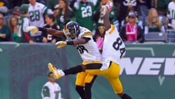 Oct 13, 2013; East Rutherford, NJ, USA; Pittsburgh Steelers wide receiver Emmanuel Sanders (88) and wide receiver Antonio Brown (84) celebrate Sanders