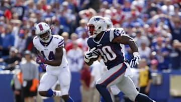 Sep 20, 2015; Orchard Park, NY, USA; New England Patriots cornerback Duron Harmon (30) runs with the ball after he intercepts a pass as Buffalo Bills wide receiver Sammy Watkins (14) pursues during the first half at Ralph Wilson Stadium. Mandatory Credit: Kevin Hoffman-USA TODAY Sports