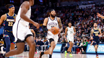DENVER, CO - FEBRUARY 06: DeAndre' Bembry #95 of the Brooklyn Nets drives against the Denver Nuggets at Ball Arena on February 6, 2022 in Denver, Colorado. NOTE TO USER: User expressly acknowledges and agrees that, by downloading and or using this photograph, User is consenting to the terms and conditions of the Getty Images License Agreement. (Photo by Jamie Schwaberow/Getty Images)