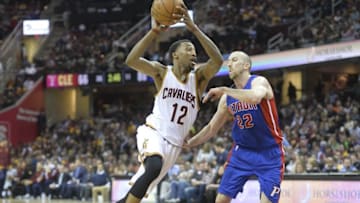Apr 13, 2016; Cleveland, OH, USA; Cleveland Cavaliers guard Jordan McRae (12) drives against Detroit Pistons guard Steve Blake (22) in the third quarter at Quicken Loans Arena. Mandatory Credit: David Richard-USA TODAY Sports