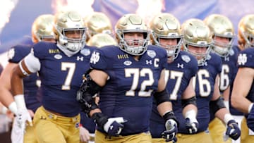 CHARLOTTE, NORTH CAROLINA - DECEMBER 19: Offensive lineman Robert Hainsey #72 of the Notre Dame Fighting Irish takes the field before the ACC Championship game against the Clemson Tigers at Bank of America Stadium on December 19, 2020 in Charlotte, North Carolina. (Photo by Jared C. Tilton/Getty Images)