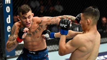 LOS ANGELES, CA - AUGUST 04: (L-R) Marlon Vera of Ecuador punches Wuliji Buren of China in their bantamweight fight during the UFC 227 event inside Staples Center on August 4, 2018 in Los Angeles, California. (Photo by Jeff Bottari/Zuffa LLC/Zuffa LLC via Getty Images)