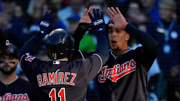 CHICAGO, IL - MAY 22: Michael Brantley #23 of the Cleveland Indians (R) congratulates Jose Ramirez #11 on his three-run home run against the Chicago Cubs during the third inning at Wrigley Field on May 22, 2018 in Chicago, Illinois. (Photo by Jon Durr/Getty Images)