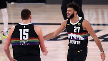 LAKE BUENA VISTA, FLORIDA - SEPTEMBER 13: Jamal Murray #27 of the Denver Nuggets and Nikola Jokic #15 of the Denver Nuggets react during the fourth quarter against the LA Clippers in Game Six of the Western Conference Second Round during the 2020 NBA Playoffs at AdventHealth Arena at the ESPN Wide World Of Sports Complex on September 12, 2020 in Lake Buena Vista, Florida. NOTE TO USER: User expressly acknowledges and agrees that, by downloading and or using this photograph, User is consenting to the terms and conditions of the Getty Images License Agreement. (Photo by Michael Reaves/Getty Images)