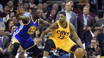 Jun 9, 2015; Cleveland, OH, USA; Cleveland Cavaliers center Tristan Thompson (13) handles the ball against Cleveland Cavaliers forward LeBron James (23) during the first quarter in game three of the NBA Finals at Quicken Loans Arena. Mandatory Credit: Bob Donnan-USA TODAY Sports