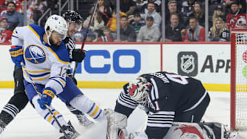 Apr 11, 2023; Newark, New Jersey, USA; New Jersey Devils goaltender Vitek Vanecek (41) covers the puck as Buffalo Sabres left wing Jordan Greenway (12) battles New Jersey Devils right wing Nathan Bastian (14) during the second period at Prudential Center. Mandatory Credit: Vincent Carchietta-USA TODAY Sports