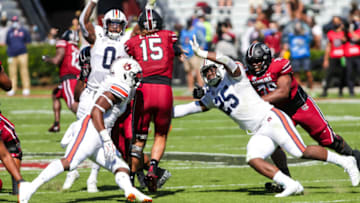 Oct 17, 2020; Columbia, South Carolina, USA; Auburn football linebacker Colby Wooden (25) closes in on South Carolina Gamecocks quarterback Collin Hill (15) during the second quarter at Williams-Brice Stadium. Mandatory Credit: Jeff Blake-USA TODAY Sports