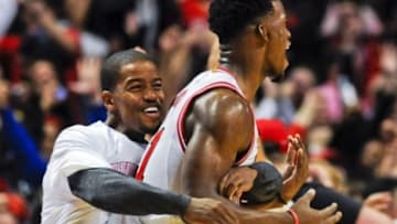 Oct 16, 2014; Chicago, IL, USA; Chicago Bulls guard Jimmy Butler (21) and teammate Chicago Bulls guard Kim English (24) react after Butler shot a last second three-point basket to beat the Atlanta Hawks 85-84 during the second half at the United Center. Mandatory Credit: Matt Marton-USA TODAY Sports