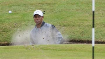 Jul 19, 2014; Wirral, GBR; Tiger Woods plays from a bunker on the 15th green during the third round at the 143rd Open Championship at The Royal Liverpool Golf Club. Mandatory Credit: Steve Flynn-USA TODAY Sports