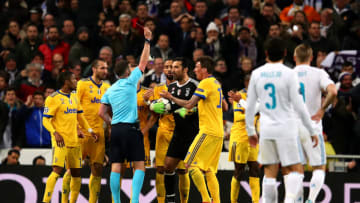 MADRID, SPAIN - APRIL 11: Gianluigi Buffon of Juventus is shown the red card by referee Michael Oliver during the UEFA Champions League Quarter Final, second leg match between Real Madrid and Juventus at Estadio Santiago Bernabeu on April 11, 2018 in Madrid, Spain. (Photo by Chris Brunskill Ltd/Getty Images)
