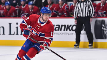MONTREAL, QC - APRIL 06: Max Domi #13 of the Montreal Canadiens skates the puck in the second period against the Toronto Maple Leafs during the NHL game at the Bell Centre on April 6, 2019 in Montreal, Quebec, Canada. The Montreal Canadiens defeated the Toronto Maple Leafs 6-5 in a shootout. (Photo by Minas Panagiotakis/Getty Images)