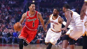 Apr 9, 2016; Chicago, IL, USA; Chicago Bulls guard Derrick Rose (1) drives past Cleveland Cavaliers guard Kyrie Irving (2) during the first quarter at the United Center. Mandatory Credit: Dennis Wierzbicki-USA TODAY Sports