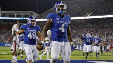 Sep 5, 2015; Lexington, KY, USA; Kentucky Wildcats running back Mikel Horton (4) celebrate in the end zone with fullback Will Thomas Collins (48) during the game against the Louisiana Lafayette Ragin Cajuns at Commonwealth Stadium. Kentucky defeated Louisiana Lafayette 40-33. Mandatory Credit: Mark Zerof-USA TODAY Sports